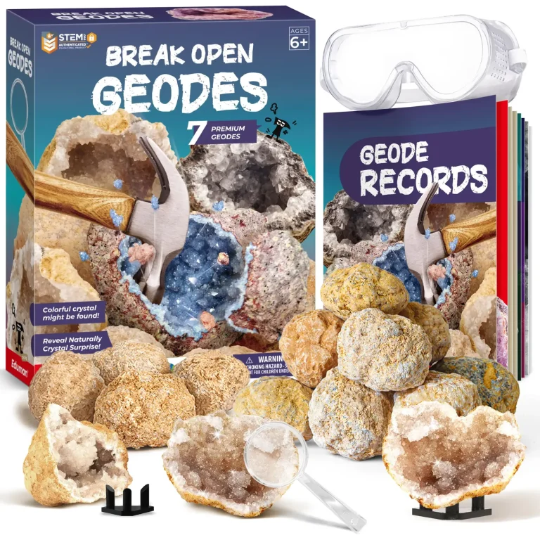 Seven-geode kit with two opened specimens on black stands, goggles, a magnifier, and a Geode Records booklet